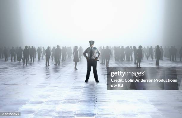 security guard standing in front of crowd - australia police stock-fotos und bilder