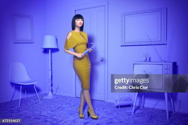 caucasian woman in purple old-fashioned livingroom holding hammer - changing things ストックフォトと画像