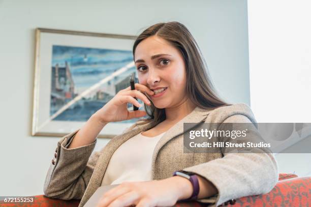 stressed businesswoman biting fingernails - tensed idaho stock pictures, royalty-free photos & images