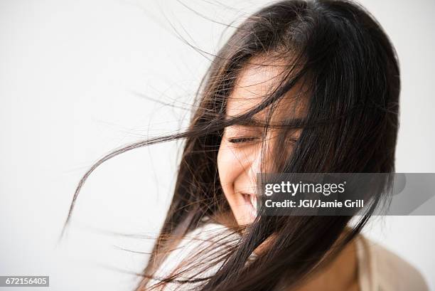 hair of indian woman blowing in wind - hair blowing stockfoto's en -beelden