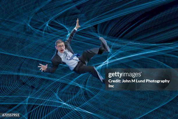 mixed race businessman floating in cyberspace - safety net stock pictures, royalty-free photos & images