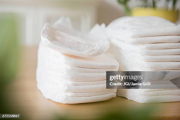 piles of diapers - pañal fotografías e imágenes de stock