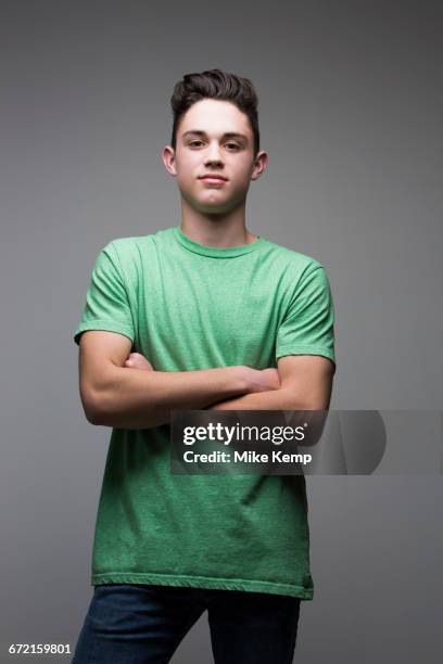 portrait of smiling caucasian boy - serious teenager boy ストックフォトと画像