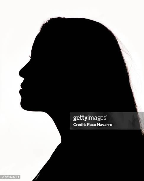 silhouette profile of hispanic woman - profile woman silhouette stock-fotos und bilder