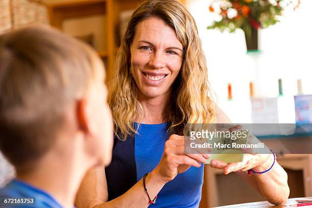 caucasian mother teaching son with flash card - flash card stock pictures, royalty-free photos & images