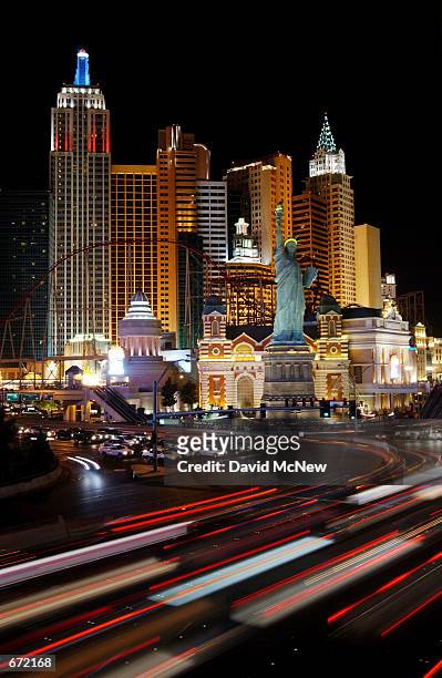 Traffic streaks past replicas of the Statue of Liberty and New York's skyline at the New York New York hotel, November 16 in Las Vegas, NV. Despite...