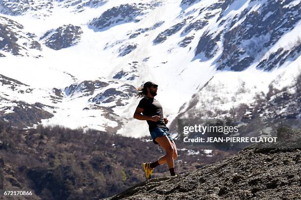 Ultra-trail runner Anton Krupicka runs during a trainning session on April 14, 2017 in Les Houches by the Mont Blanc mountain, in the Alps. - He runs...