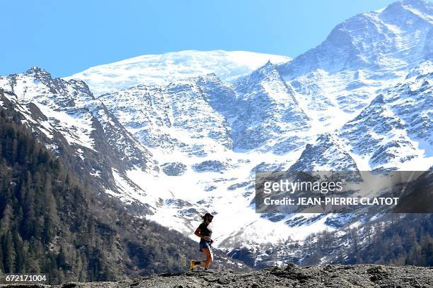 Ultra-trail runner Anton Krupicka runs during a trainning session on April 14, 2017 in Les Houches by the Mont Blanc mountain, in the Alps. - He runs...