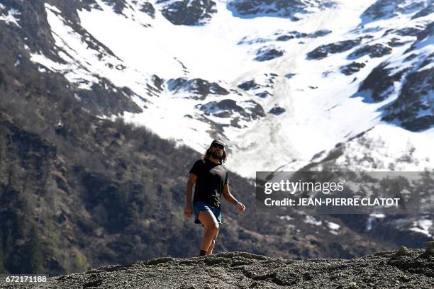 Ultra-trail runner Anton Krupicka runs during a trainning session on April 14, 2017 in Les Houches by the Mont Blanc mountain, in the Alps. - He runs...