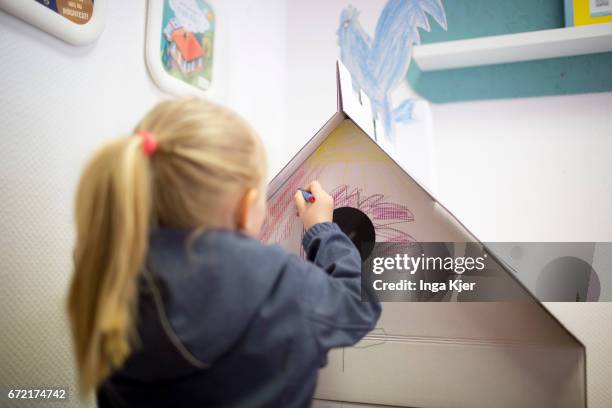 Berlin, Germany Children are drawing in a social Pop-up-Store on April 20, 2017 in Berlin, Germany. Founder of this project is the association...