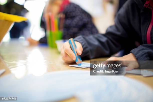 Berlin, Germany Children are drawing in a social Pop-up-Store on April 20, 2017 in Berlin, Germany. Founder of this project is the association...