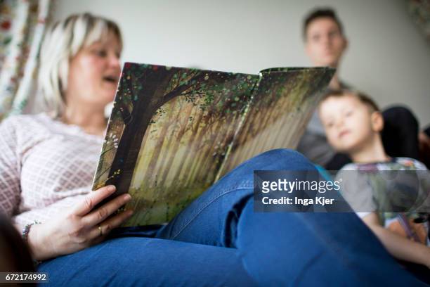 Berlin, Germany Children are sitting on a bench during a read out session in a social Pop-up-Store on April 20, 2017 in Berlin, Germany. Founder of...