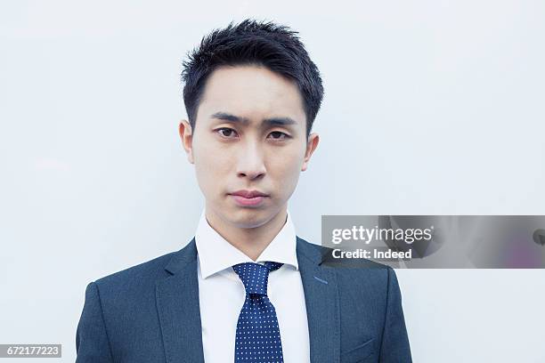 portrait of serious young businessman - 見つめる ストックフォトと画像