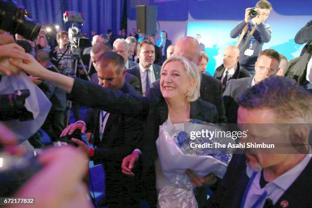 National Front leader Marine Le Pen shakes hands with supporters at the Espace Francios Mitterrand on April 23, 2017 in Henin Beaumont, France....