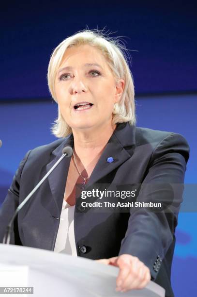National Front leader Marine Le Pen addresses activists at the Espace Francios Mitterrand on April 23, 2017 in Henin Beaumont, France. According to...