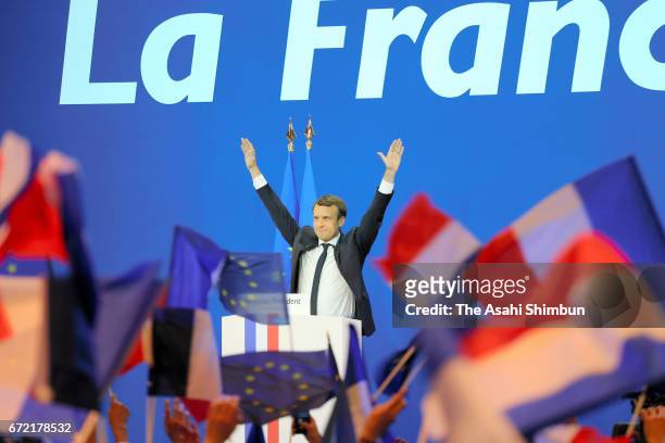 Founder and Leader of the political movement 'En Marche !' Emmanuel Macron waves after winning the lead percentage of votes in the first round of the...