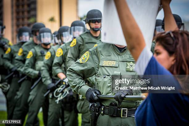 protestors and police clash at a trump rally. - donald trump rally stock pictures, royalty-free photos & images