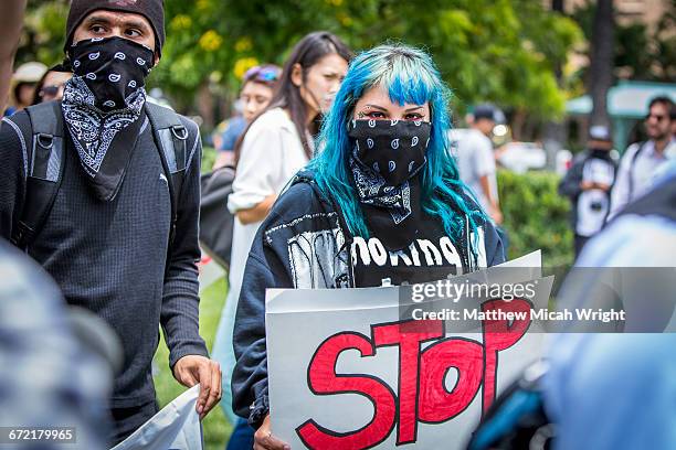 protestors and police clash at a trump rally. - protest stock pictures, royalty-free photos & images