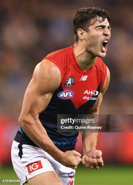 Christian Petracca of the Demons celebrates kicking a goal during the round five AFL match between the Richmond Tigers and the Melbourne Demons at...