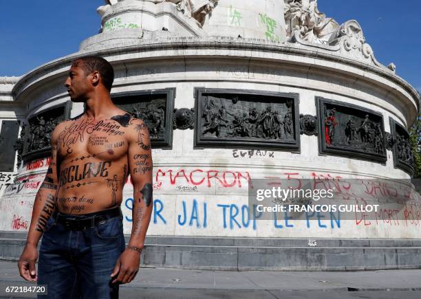 Man with his body covered with racist insults poses during an event organized by the Conseil Representatif des Associations Noires de France - CRAN...