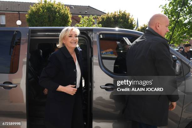 French presidential election candidate for the far-right Front National party Marine Le Pen , escorted by her bodyguard Thierry Legier, arrives for a...