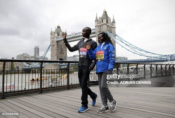 Kenya's Daniel Wanjiru and Mary Keitany arrive for a photocall beside Tower Bridge, the day after winning the men's and women's elite races at the...