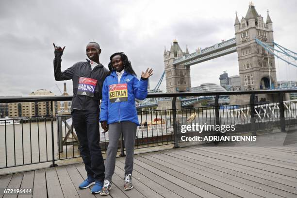 Kenya's Daniel Wanjiru and Mary Keitany pose during a photocall beside Tower Bridge, the day after winning the men's and women's elite races at the...