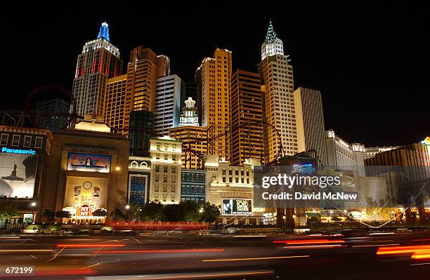 Traffic on the Las Vegas Strip streaks past the repica of the New York's skyline that forms the New York New York hotel, November 16 in Las Vegas,...