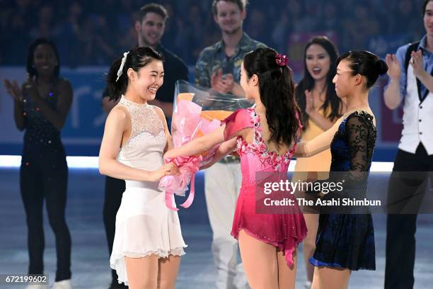 Kanako Murakami of Japan receives flower bunches by Marin Honda and Kaori Sakamoto during her retirement ceremony at the gala exhibition during day...