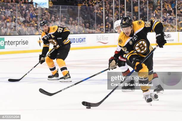 David Pastrnak of the Boston Bruins skates with the puck against the Ottawa Senators in Game Six of the Eastern Conference First Round during the...