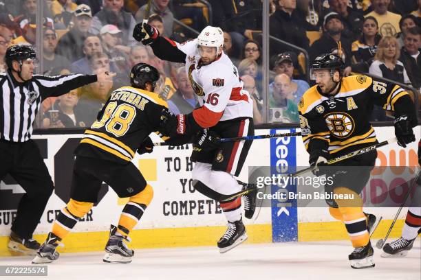Clarke MacArthur of the Ottawa Senators skates against David Pastrnak and Patrice Bergeron of the Boston Bruins in Game Six of the Eastern Conference...