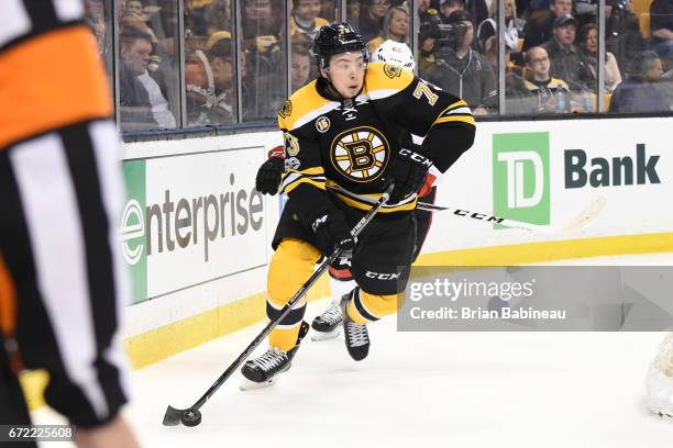 Charlie McAvoy of the Boston Bruins skates with the puck against the Ottawa Senators in Game Six of the Eastern Conference First Round during the...