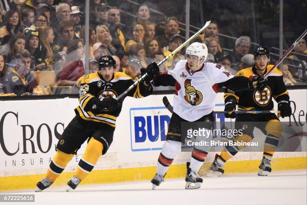 Brad Marchand of the Boston Bruins skates against Jean-Gabriel Pageau of the Ottawa Senators in Game Six of the Eastern Conference First Round during...