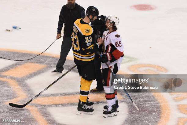 Zdeno Chara of the Boston Bruins shakes hands with Erik Karlsson of the Ottawa Senators after Game Six of the Eastern Conference First Round during...