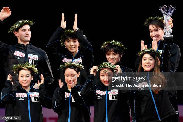 Gold medalists Japan celebrate on the podium at the medal ceremony during day three of the ISU World Team Trophy at Yoyogi Nationala Gymnasium on...