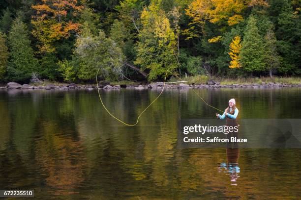 girl fishing in a river - ottawa fall stock pictures, royalty-free photos & images