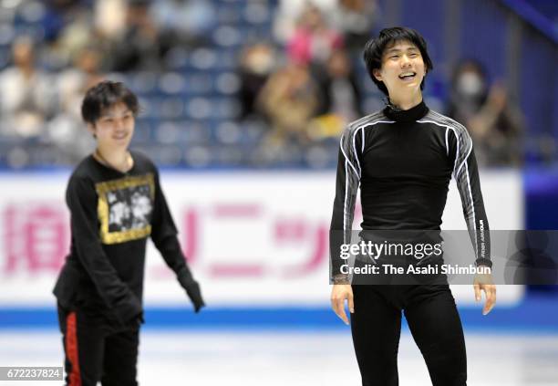 Shoma Uno and Yuzuru Hanyu of Japan look relaxed during a practice during day three of the ISU World Team Trophy at Yoyogi Nationala Gymnasium on...