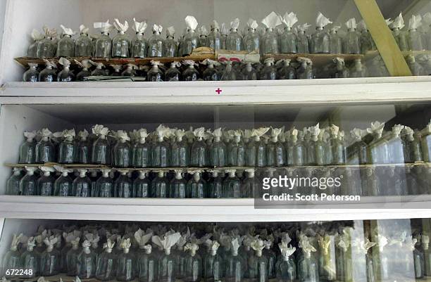 Bottles of a harmless strain of anthrax [strain 34F2] which has been cultured in Afghanistan for decades to make vaccines for sheep, sit on a shelf...