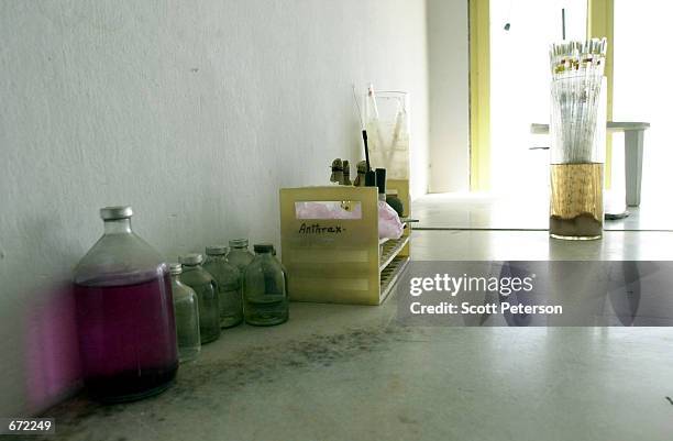 Bottles of a harmless strain of anthrax [strain 34F2] which has been cultured in Afghanistan for decades to make vaccines for sheep, sit on the floor...