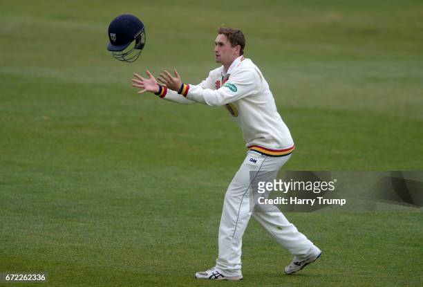 Cameron Steel of Durham catches a helmet during the Specsavers County Championship Division Two match between Gloucestershire and Durham at The...