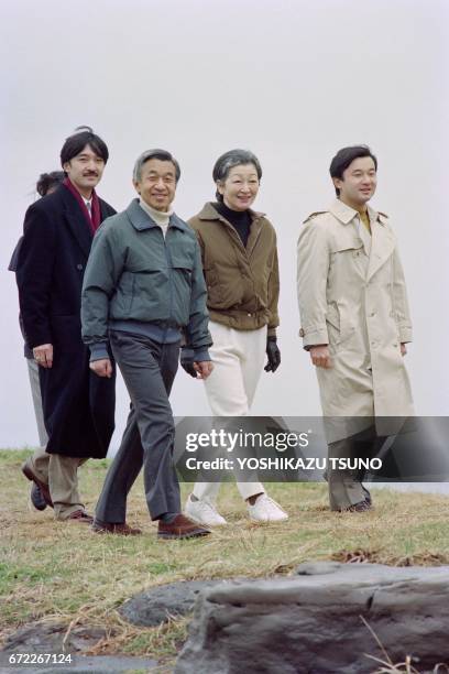 The Japanese Imperial family, Prince Akishino, Emperor Akihito, Empress Michiko and Crown Prince Naruhito walk on the beach at Hayama on January 16,...