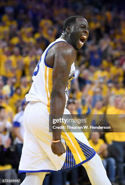 Draymond Green of the Golden State Warriors reacts after blocking the shot of Noah Vonleh of the Portland Trail Blazers in the third quarter during...
