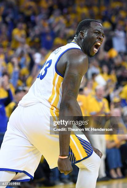 Draymond Green of the Golden State Warriors reacts after blocking the shot of Noah Vonleh of the Portland Trail Blazers in the third quarter during...