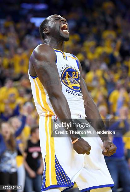 Draymond Green of the Golden State Warriors reacts after blocking the shot of Noah Vonleh of the Portland Trail Blazers in the third quarter during...