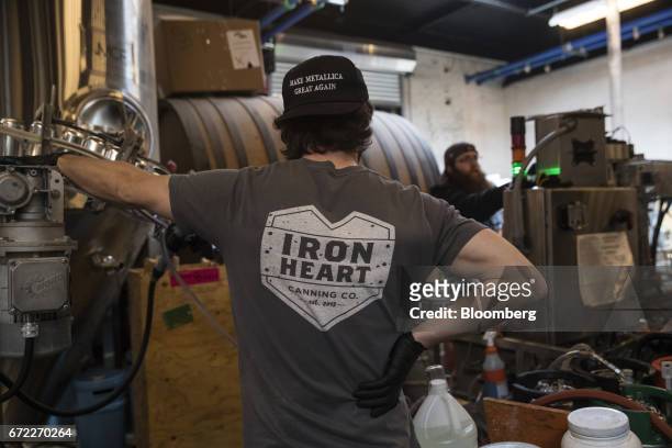 Iron Heart Canning Co. Employees operate a mobile canning machine at the Other Half Brewing Co. In the Gowanus neighborhood in the Brooklyn borough...