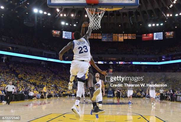 Draymond Green of the Golden State Warriors blocks the shot of Noah Vonleh of the Portland Trail Blazers in the third quarter during Game One of the...