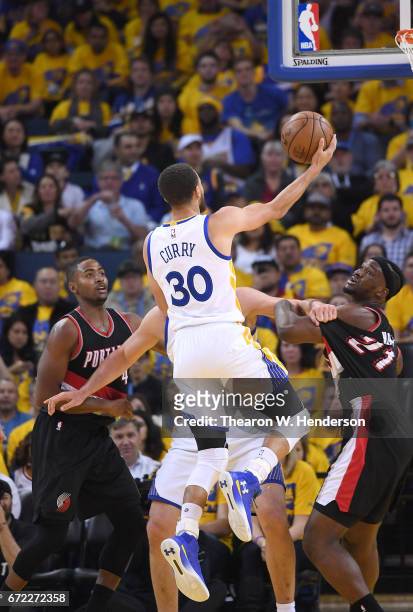 Stephen Curry of the Golden State Warriors shoots against the Portland Trail Blazers in the third quarter during Game One of the first round of the...
