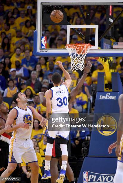 Stephen Curry of the Golden State Warriors shoots against the Portland Trail Blazers in the third quarter during Game One of the first round of the...
