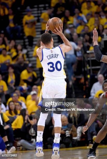 Stephen Curry of the Golden State Warriors shoots against the Portland Trail Blazers in the third quarter during Game One of the first round of the...