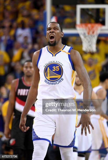 Kevin Durant of the Golden State Warriors reacts after they make a defensive stop against the Portland Trail Blazers in the fourth quarter during...